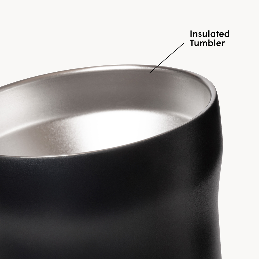 Black insulated tumbler with metallic interior on a white background