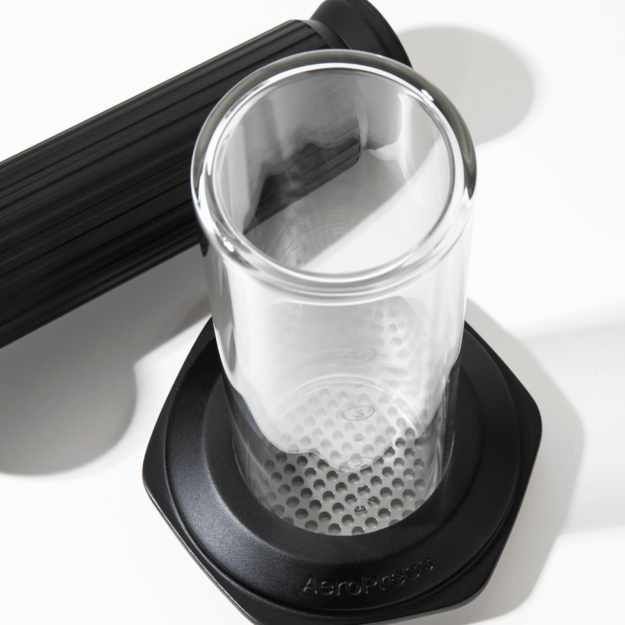 Clear glass chamber with black rubber base on a white background #color_black