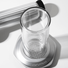 Clear AeroPress Premium with black lid on a white background #color_silver