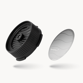 AeroPress Flow Control Cap and Stainless Steel Filter on a white background