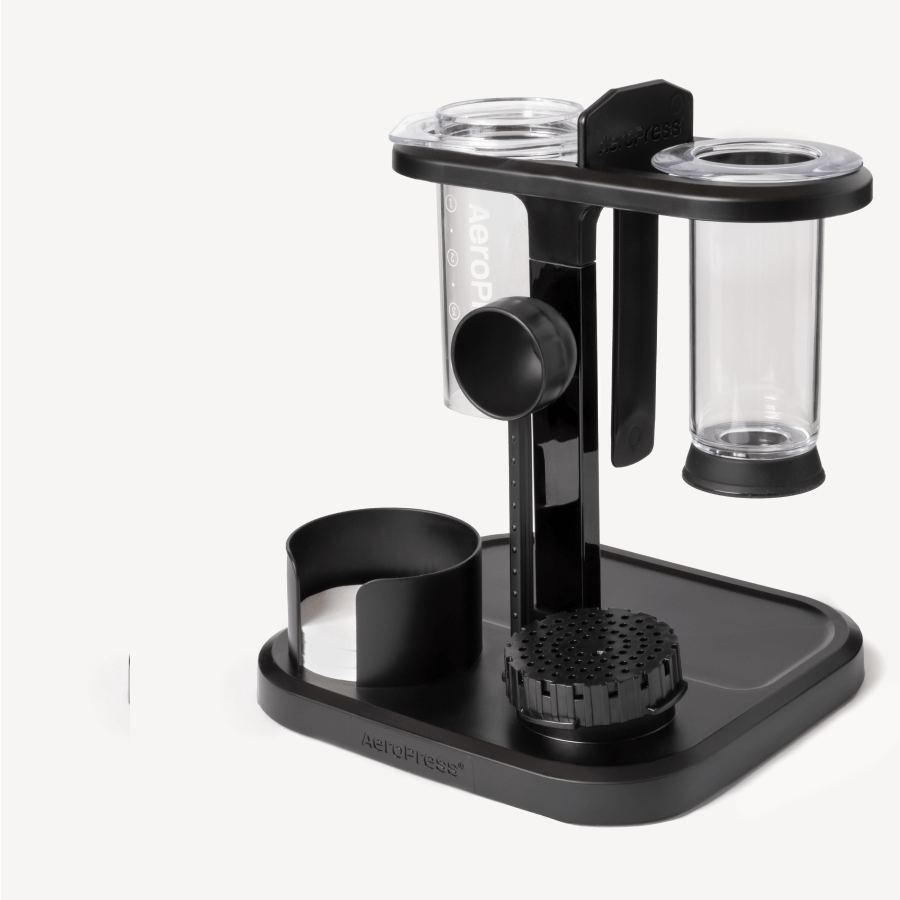 Black and clear coffee brewing device on a white background