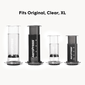 Aeropress coffee brewing device in different sizes on a white background