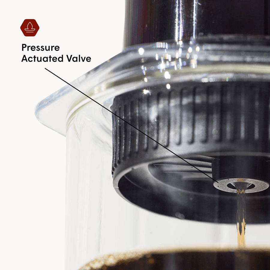Close-up of a pressure actuated valve in a coffee brewing device with text label. #color_clear