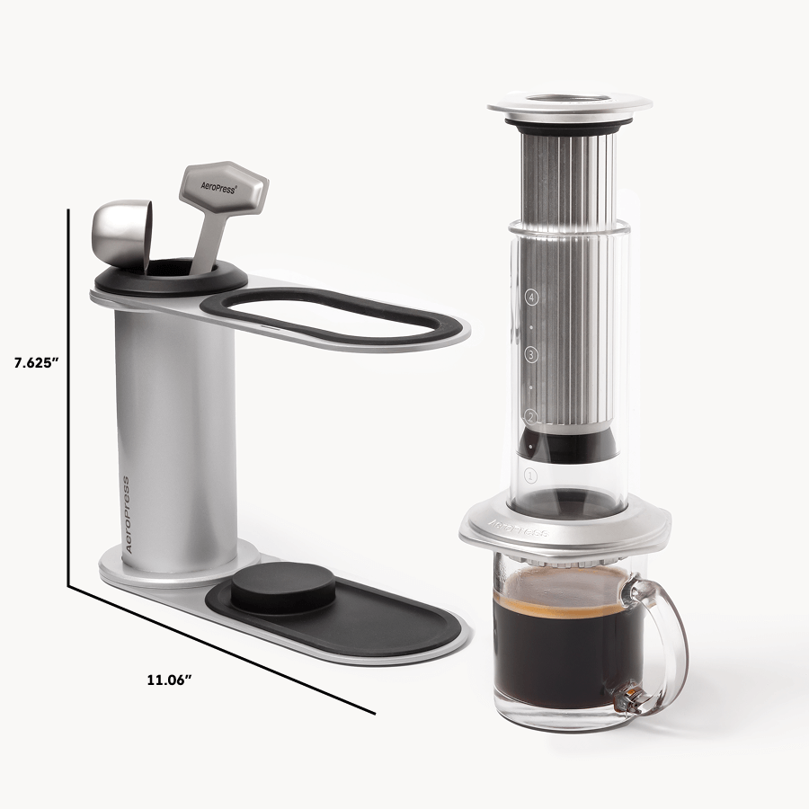 Aeropress coffee maker with a glass of coffee on a white background #color_silver