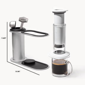 Coffee maker with dimensions and a glass of coffee on a white background  #color_white