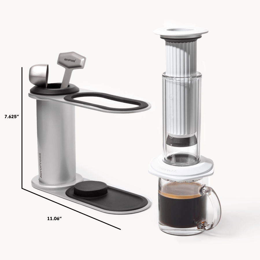 Coffee maker with dimensions and a glass of coffee on a white background  #color_white